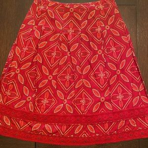 Embroidered and beaded hem skirt in shades of red and brown